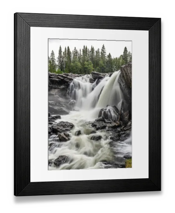 Framed Print : Powerful, foaming waterfall surrounded by trees through rough rocks Framed Print : Powerful, foaming waterfall surrounded by trees through rough rocks