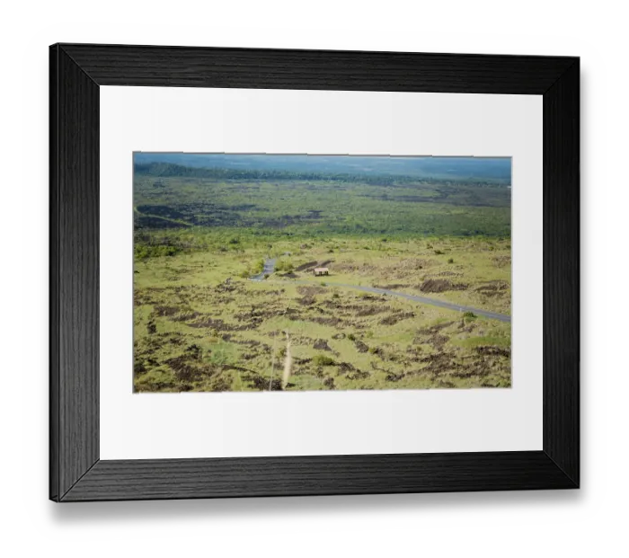 Framed Print : Landscape of a rural road surrounded by vegetation
