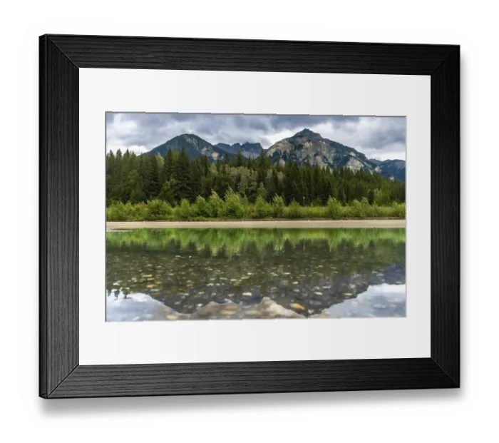 Framed Print : Calm waters reflecting the lush forest