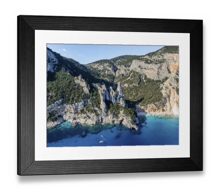 Framed Print : Picturesque rocky coast, cliffs with L'Aguglia pinnacle