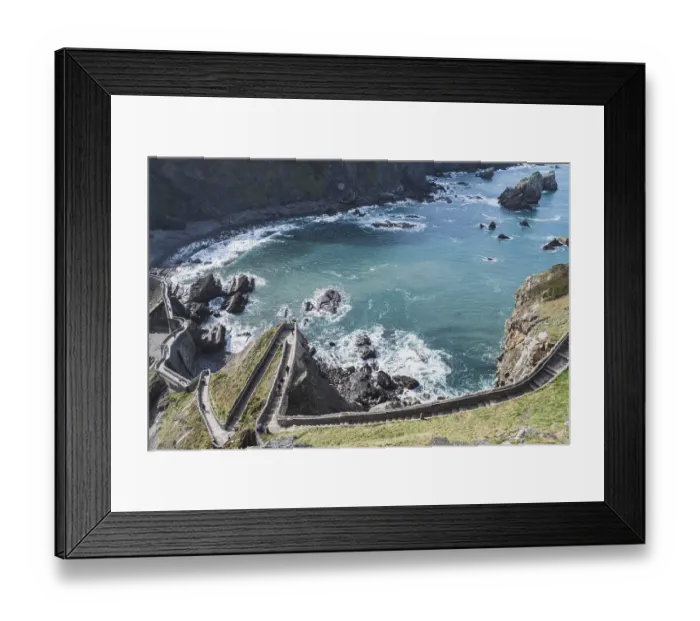 Framed Print : From above breathtaking view of a winding path leading to Gaztelugatxe islet Framed Print : From above breathtaking view of a winding path leading to Gaztelugatxe islet