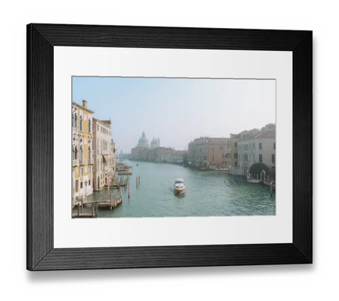 Framed Print : Scenic view of Venice's Grand Canal with a boat navigating the peaceful waters Framed Print : Scenic view of Venice's Grand Canal with a boat navigating the peaceful waters