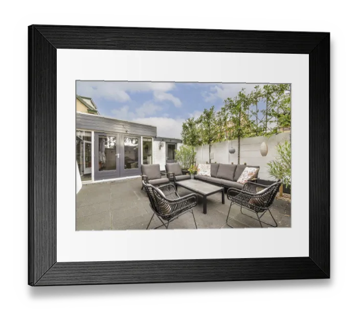 Framed Print : A beautifully designed outdoor patio featuring chic furniture and greenery Framed Print : A beautifully designed outdoor patio featuring chic furniture and greenery