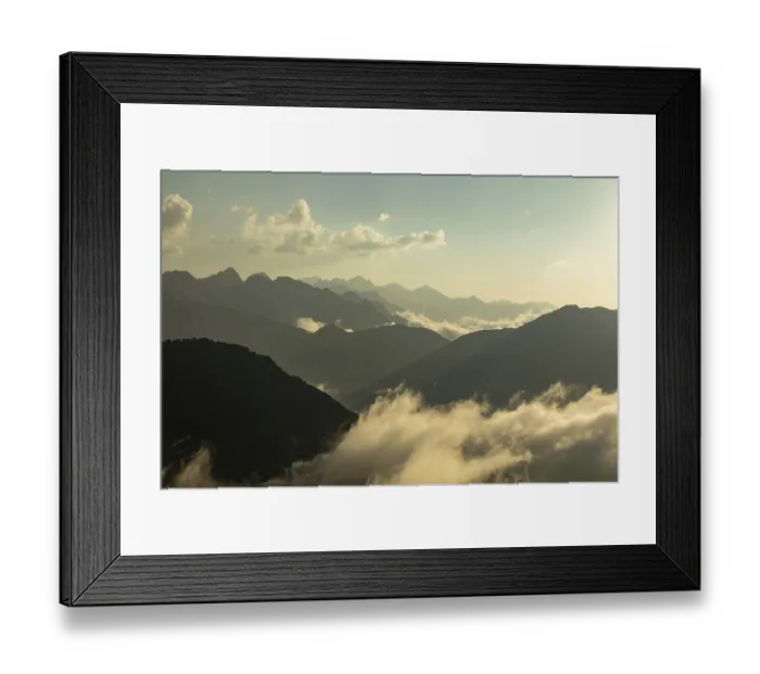 Framed Print : A breathtaking view of mist-covered mountains under a golden sunrise
