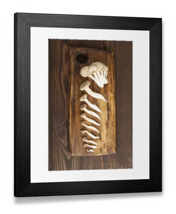 Framed Print : Raw Oyster mushroom, Pleurotus ostreatus on cutting board on brown wooden background Framed Print : Raw Oyster mushroom, Pleurotus ostreatus on cutting board on brown wooden background