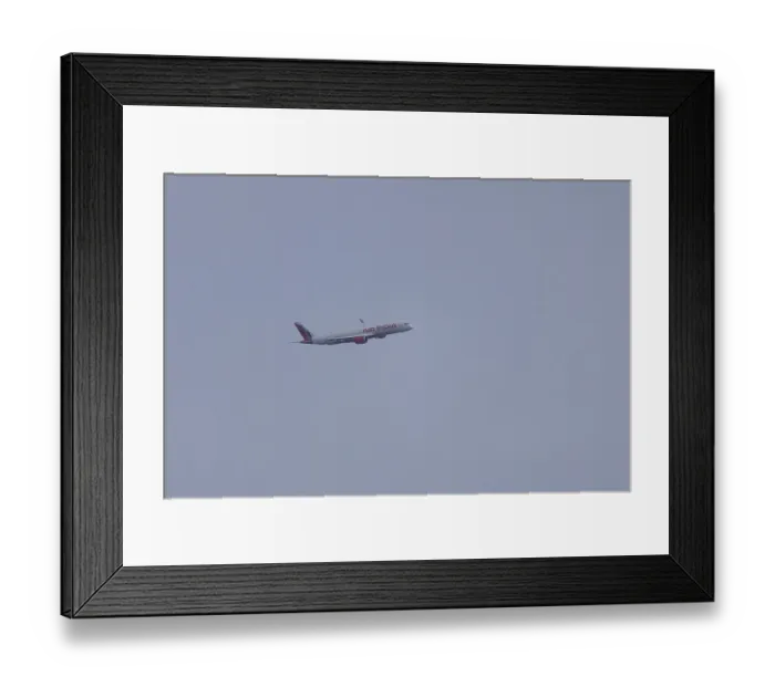 Framed Print : Aircraft of Air India airways in flight in a blue sky