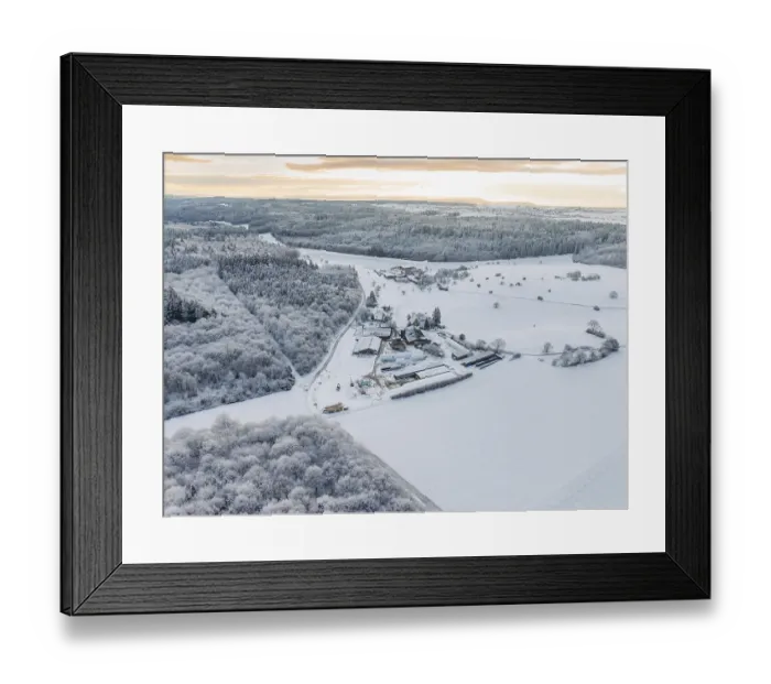 Framed Print : View of an extensive snow-covered landscape with forest