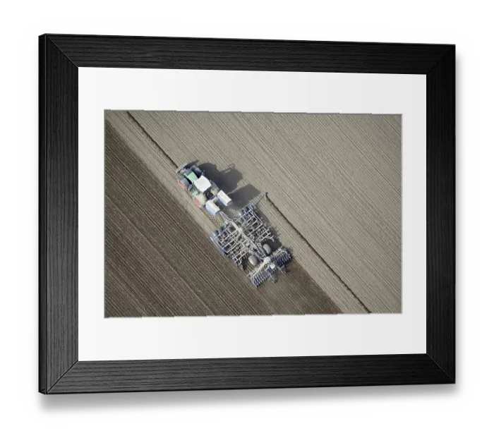 Framed Print : Modern agriculture, tractor working arable land in a field Framed Print : Modern agriculture, tractor working arable land in a field
