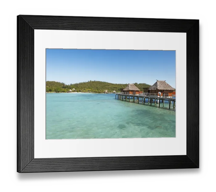 Framed Print : Overwater bungalows in the sea