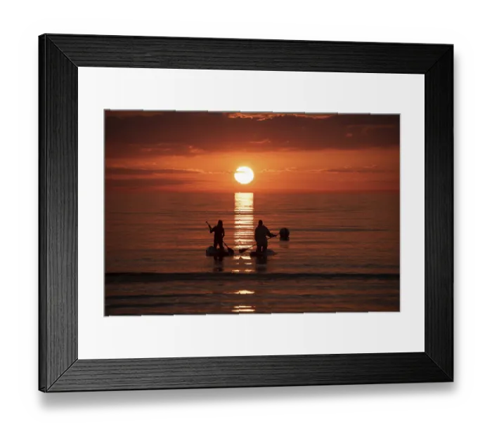 Framed Print : Two people paddling in the calm sea at sunset on stand-up paddle Framed Print : Two people paddling in the calm sea at sunset on stand-up paddle