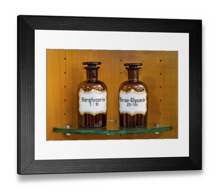 Framed Print : Old glass bottles for medical ingredients labeled glycerin in a pharmacy Framed Print : Old glass bottles for medical ingredients labeled glycerin in a pharmacy