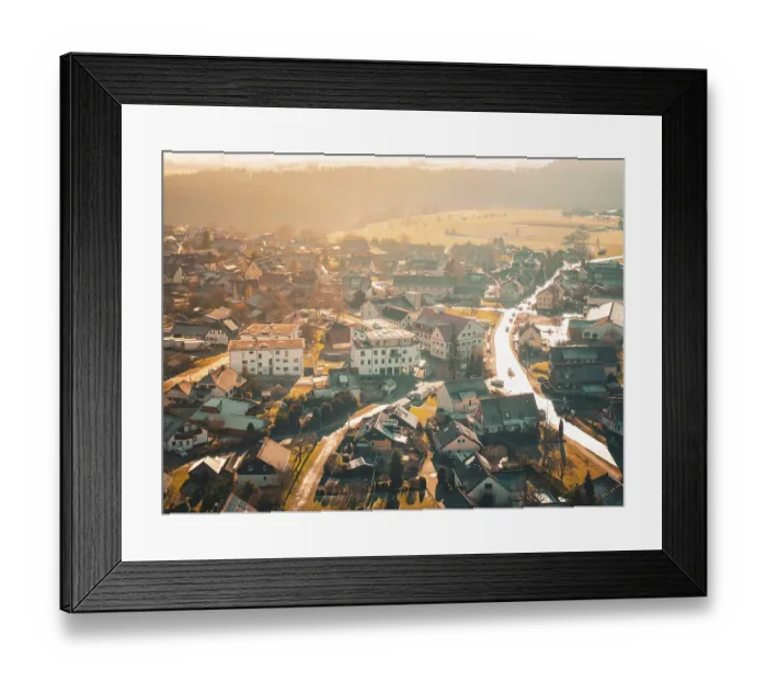 Framed Print : Bird's eye view of a village landscape in warm autumnal light Framed Print : Bird's eye view of a village landscape in warm autumnal light