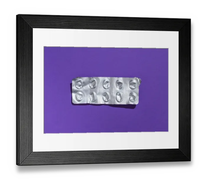 Framed Print : Empty tablet blister pack against a monochrome background Framed Print : Empty tablet blister pack against a monochrome background