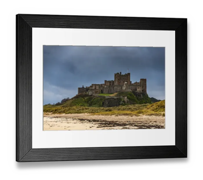 Framed Print : Sandy coast at low tide with Bamburgh Castle