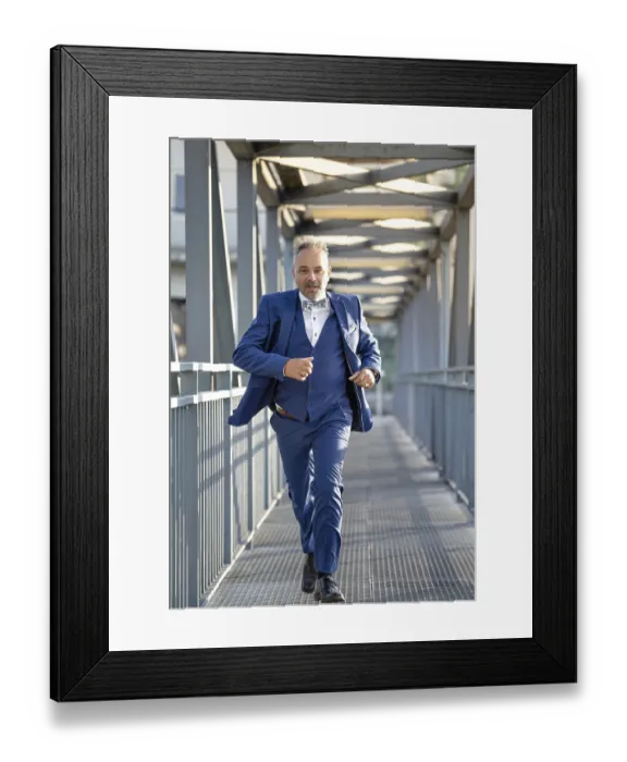 Framed Print : Man in blue suit fleeing over bridge