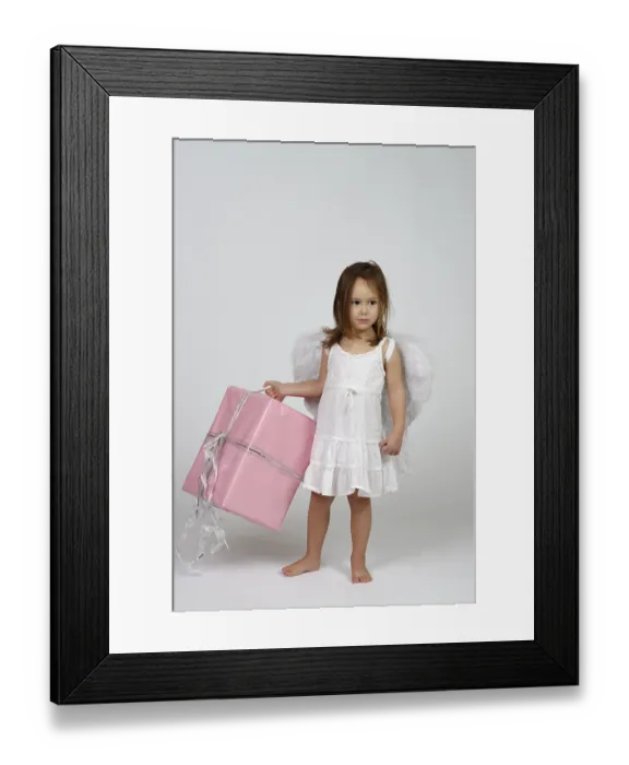 Framed Print : Girl dressed as angel, with Christmas gift