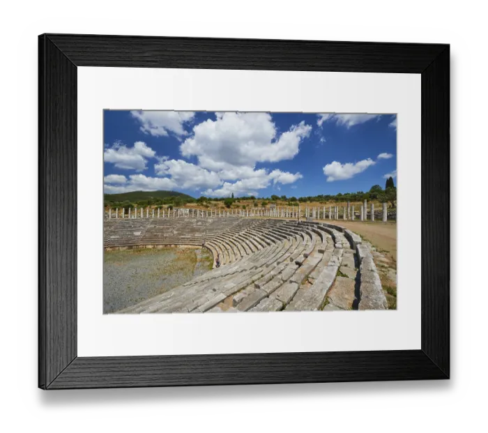 Framed Print : Ancient stadium with rows of seats and wild grass under a cloudy sky Framed Print : Ancient stadium with rows of seats and wild grass under a cloudy sky