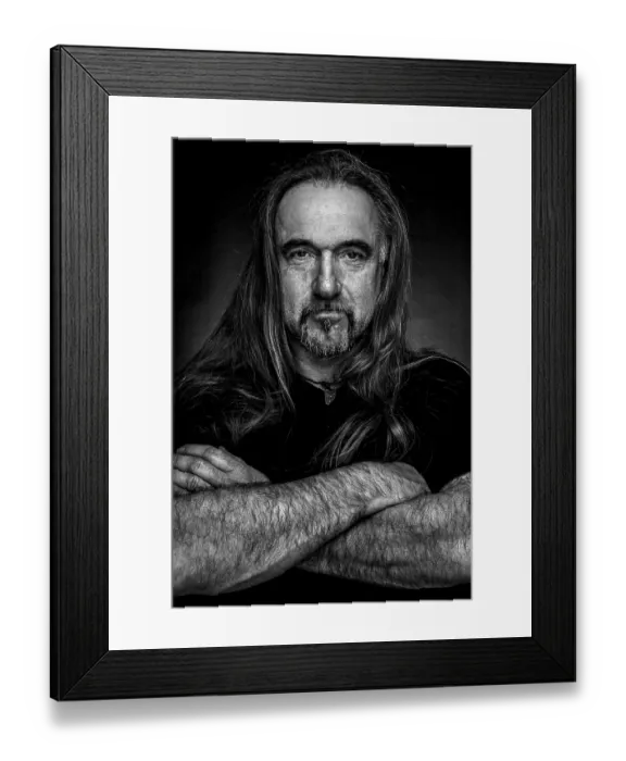 Framed Print : Man with long hair and hand with folded arms Framed Print : Man with long hair and hand with folded arms