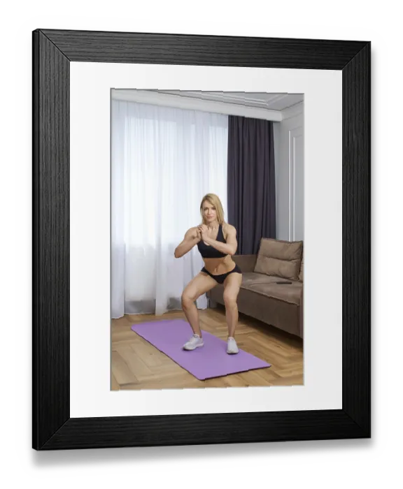 Framed Print : Blonde bodybuilder woman doing squats at home