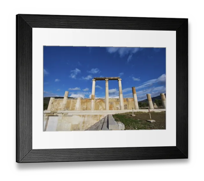 Framed Print : Remains of an ancient temple with majestic columns under a slightly cloudy sky