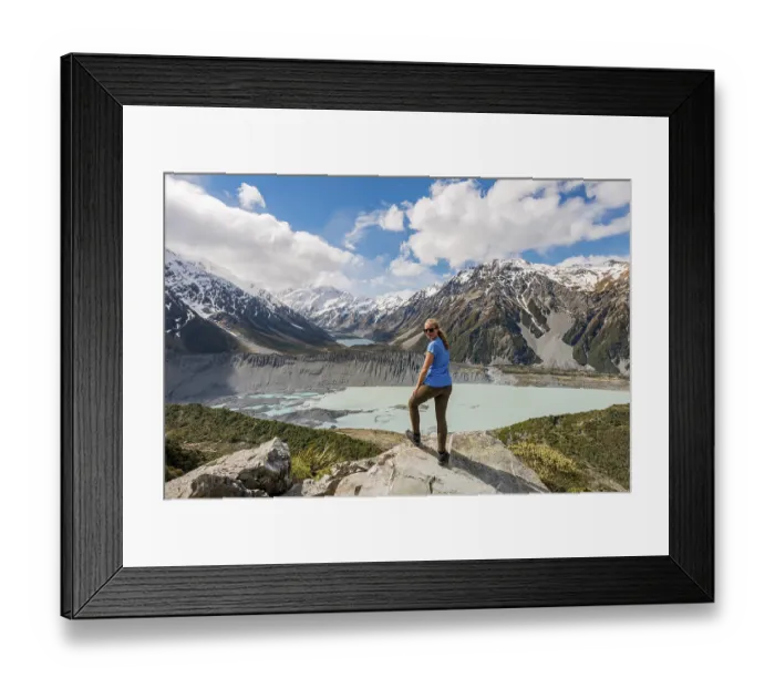 Framed Print : Hiker standing on rocks, view into the Hooker Valley from Sealy Tarns Track