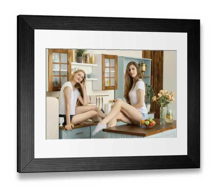 Framed Print : Two young attractive women drinking coffee and talking in the kitchen Framed Print : Two young attractive women drinking coffee and talking in the kitchen
