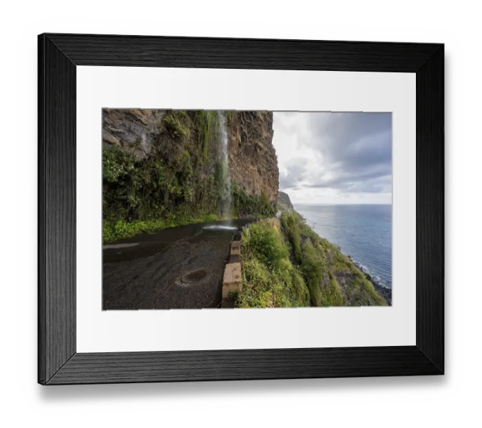 Framed Print : Cascata dos Anjos, waterfall over a road on the coast