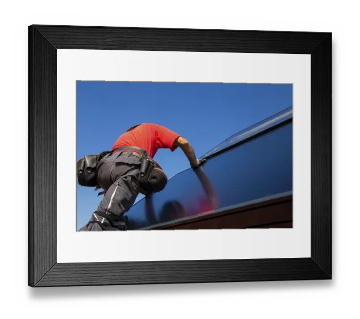 Framed Print : Installation of solar collectors for solar thermal energy
