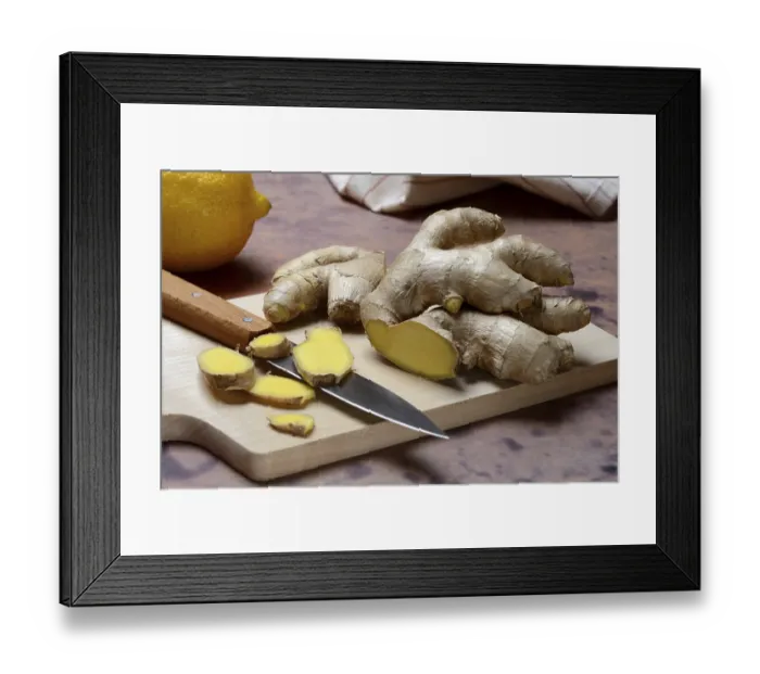 Framed Print : Ginger, ginger root cut with ginger slices on wooden boards