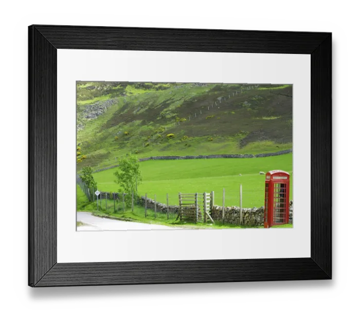 Framed Print : Telephone box in lonely green landscape