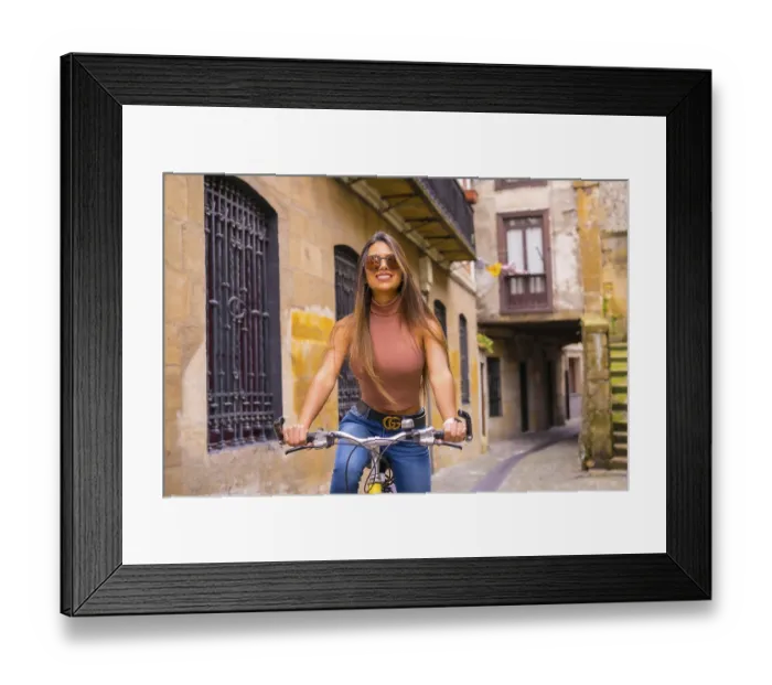 Framed Print : Pretty latin woman with sunglasses doing bicycle sightseeing in the city through the old town Framed Print : Pretty latin woman with sunglasses doing bicycle sightseeing in the city through the old town