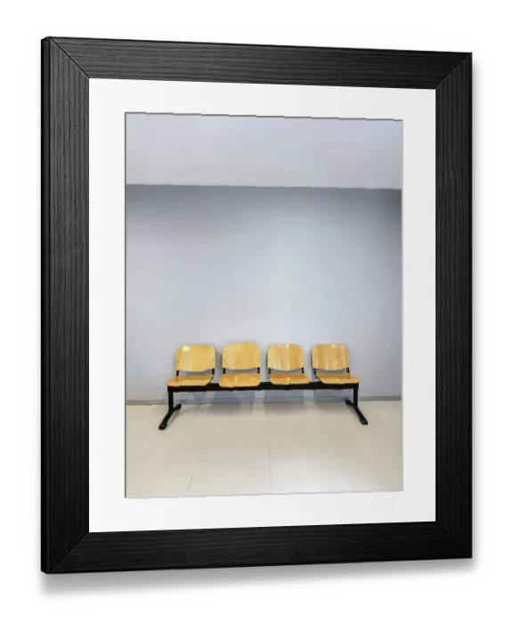 Framed Print : A row of four wooden chairs with metal frames placed against a light gray wall Framed Print : A row of four wooden chairs with metal frames placed against a light gray wall