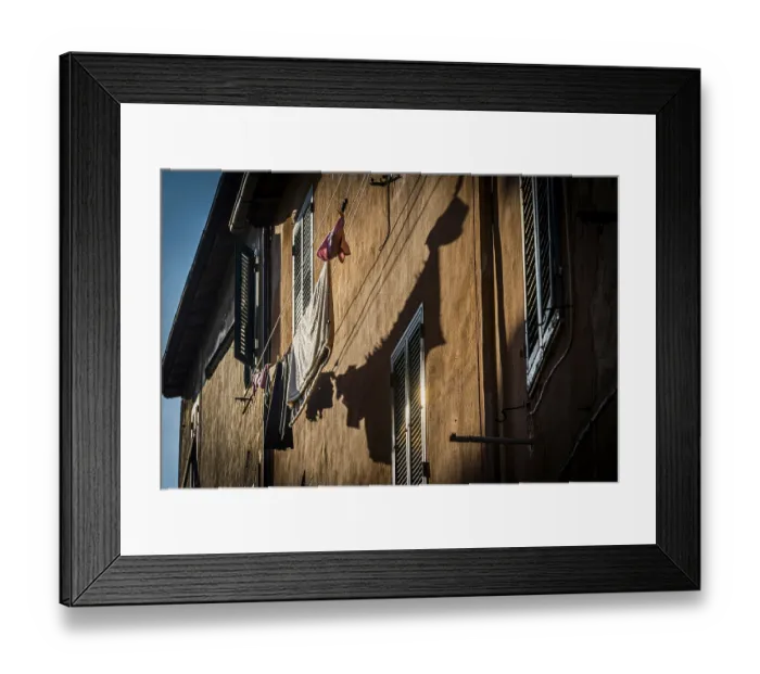 Framed Print : House facade with washing line in the afternoon sun