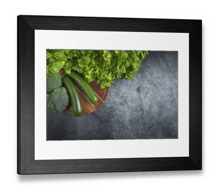 Framed Print : Fresh lettuce, courgettes and broccoli arranged on a wooden board symbolises health