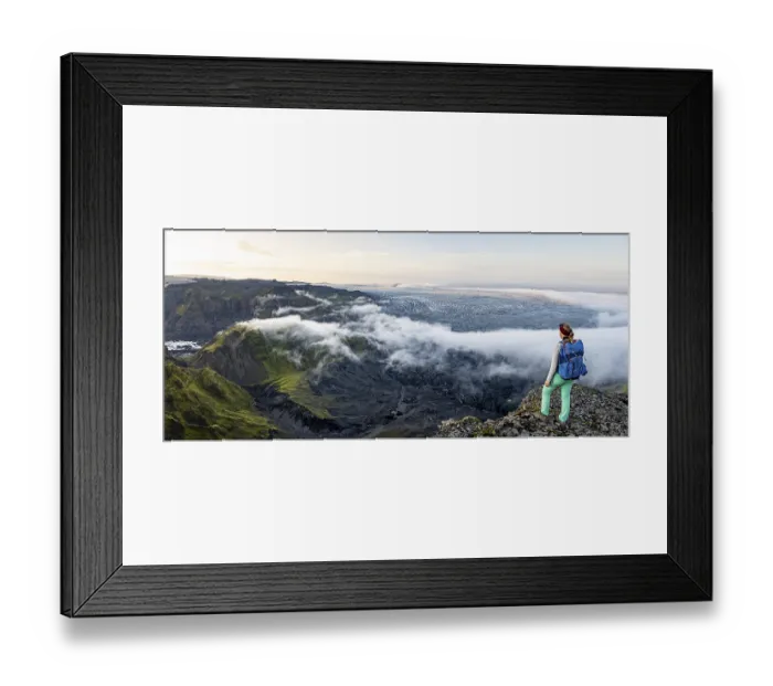 Framed Print : Hiker looks over spectacular landscape