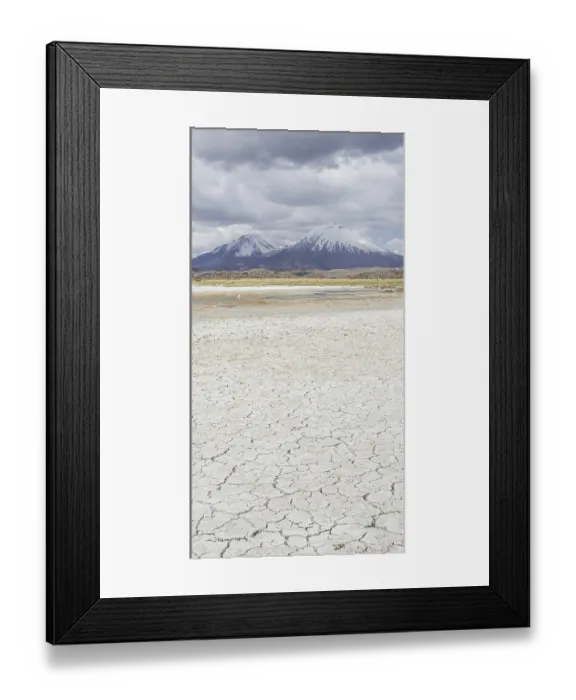 Framed Print : Dried up salt lake with the volcanos Parinacota