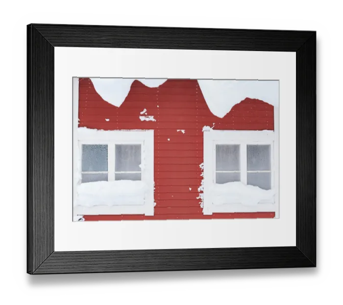 Framed Print : Snow-covered windows, red wooden house