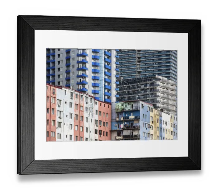 Framed Print : Old high-rise building behind it modern high-rise buildings Framed Print : Old high-rise building behind it modern high-rise buildings