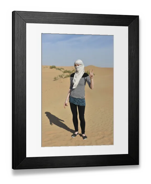 Framed Print : Woman posing in the sandy desert of Dubai Framed Print : Woman posing in the sandy desert of Dubai