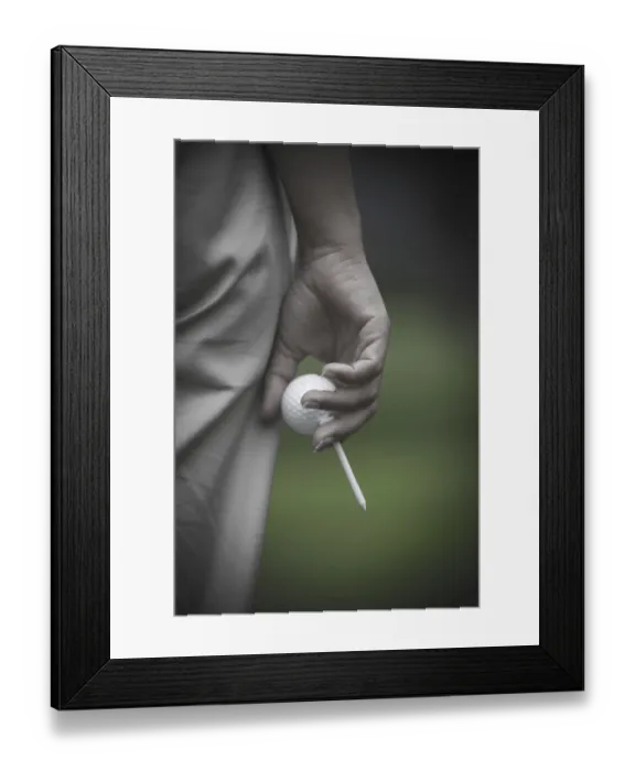 Framed Print : Golfer Holding a Golf Ball and a Tee, Switzerland