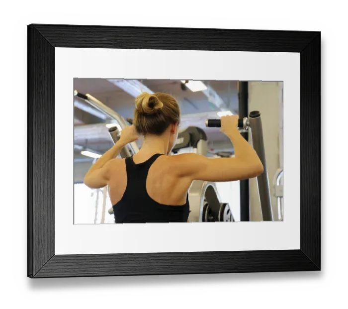Framed Print : Young woman doing strength training in the gym Framed Print : Young woman doing strength training in the gym