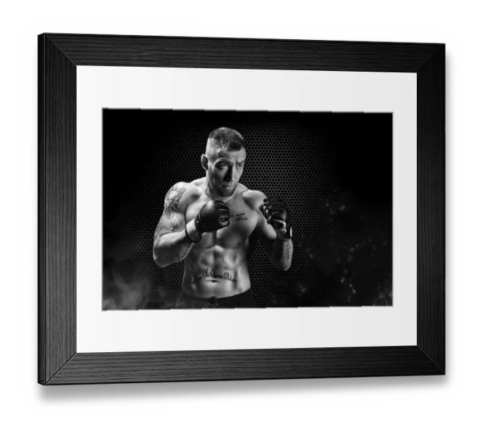 Framed Print : Mixed Martial Arts fighter posing on a metal grid background