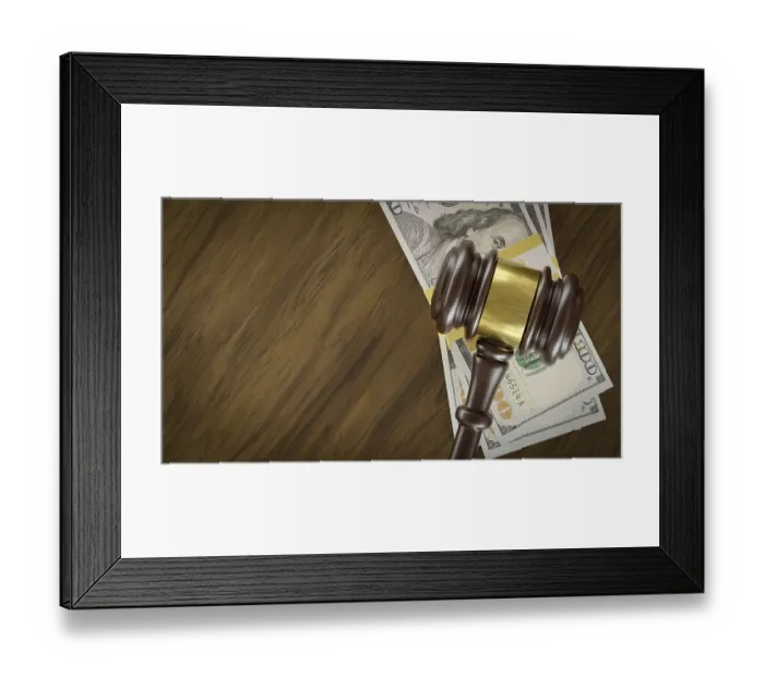 Framed Print : Overhead of gavel resting on a table and stacks of thousands of dollars with room for text Framed Print : Overhead of gavel resting on a table and stacks of thousands of dollars with room for text