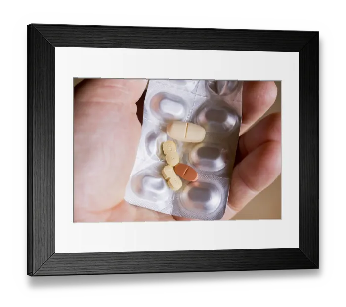 Framed Print : Hand holding a blister pack with tablets Framed Print : Hand holding a blister pack with tablets