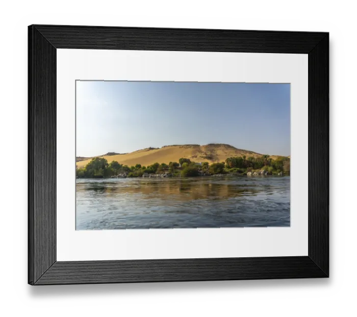 Framed Print : Small towns and ancient temples navigating the Nile River in Aswan city Framed Print : Small towns and ancient temples navigating the Nile River in Aswan city