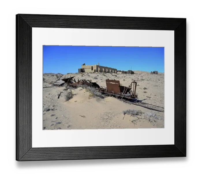 Framed Print : Wagon of an old narrow-gauge railway in the desert sand Framed Print : Wagon of an old narrow-gauge railway in the desert sand