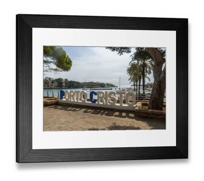 Framed Print : Large white and blue letters spelling porto cristo stand on a paved promenade Framed Print : Large white and blue letters spelling porto cristo stand on a paved promenade