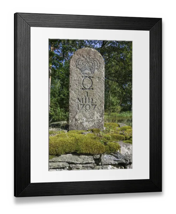 Framed Print : Old Swedish milestone from 1707 by the wayside in a grove in front of Lacko Castle by Lake Vanern Framed Print : Old Swedish milestone from 1707 by the wayside in a grove in front of Lacko Castle by Lake Vanern