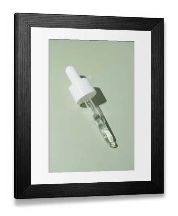 Framed Print : A single pipette dropper filled with a clear liquid Framed Print : A single pipette dropper filled with a clear liquid