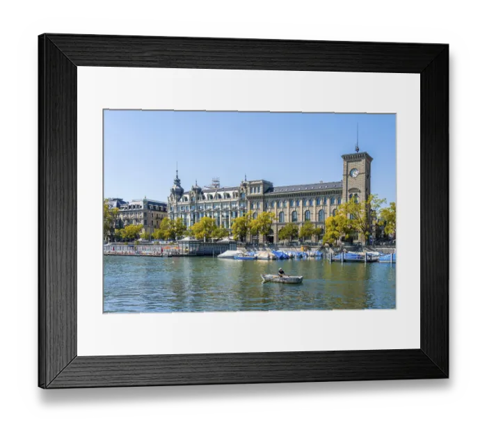 Framed Print : Rowers on the Limmat, behind Frauenbad Stadthausquai and historic houses Framed Print : Rowers on the Limmat, behind Frauenbad Stadthausquai and historic houses
